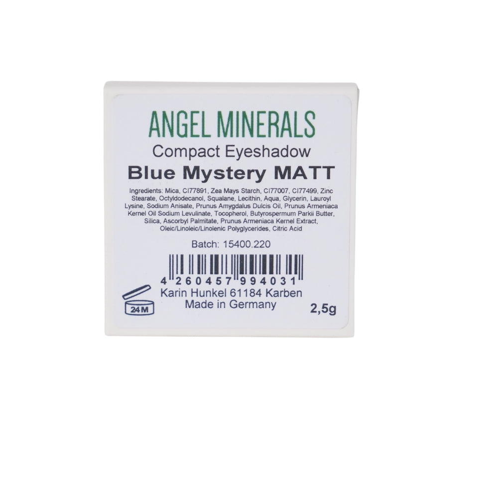 The Square container of Angel Minerals Eyeshadow Blue Mystery MATT offers a stunning Taubenblau shade. This mineral eyeshadow is made in Germany, weighs 2.5g, and includes ingredients and manufacturing details on the label, along with barcode and contact information for convenience.